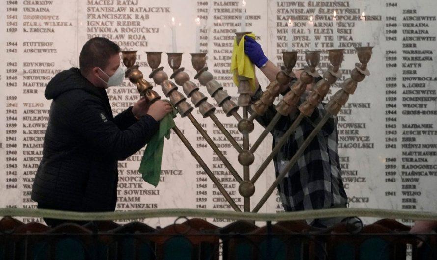 Far-right Polish lawmaker blasts menorah with fire extinguisher