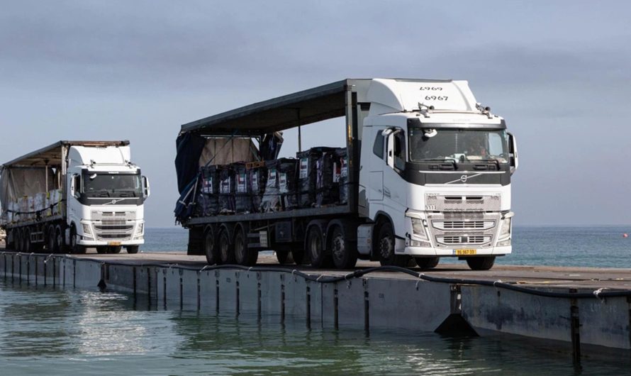 Aid starts entering Gaza through land after US ‘floating pier’ damaged by weather