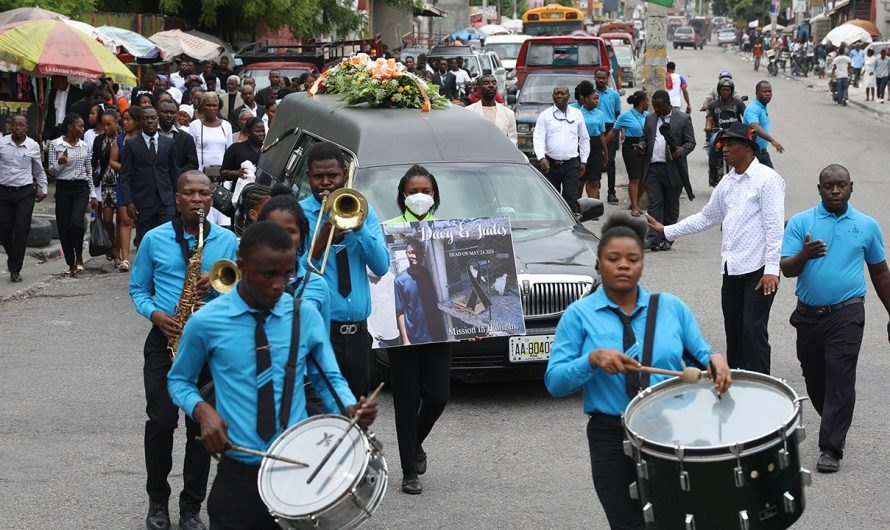 Hundreds mourn gang killings of a Haitian mission director and a young American couple